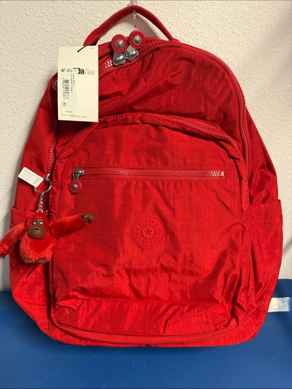 Kipling Bright Red Nylon Backpack with Monkey Charm